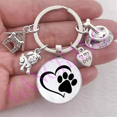 Cute dog keychain with glass pendant featuring zinc alloy and antique silver plating.