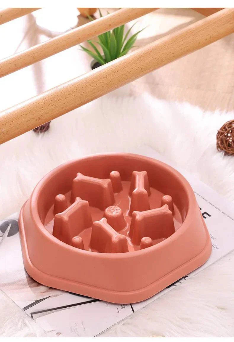 Slow feeder bowl for small and medium dogs in pink plastic.