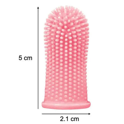 Pink silicone toothbrush for pet dental care, measuring 5 cm by 2.1 cm, shown in close-up.