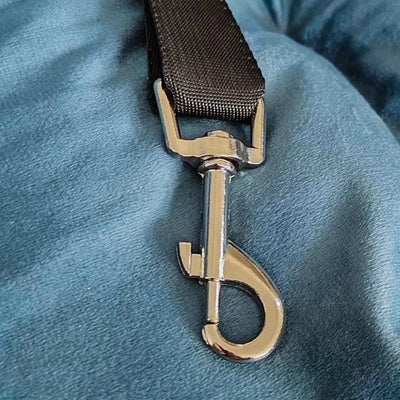 Gray car seat cover for small and medium dogs, metal clip on shiny fabric.