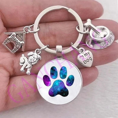 Cute dog paw keychain with glass pendant and antique silver charms.