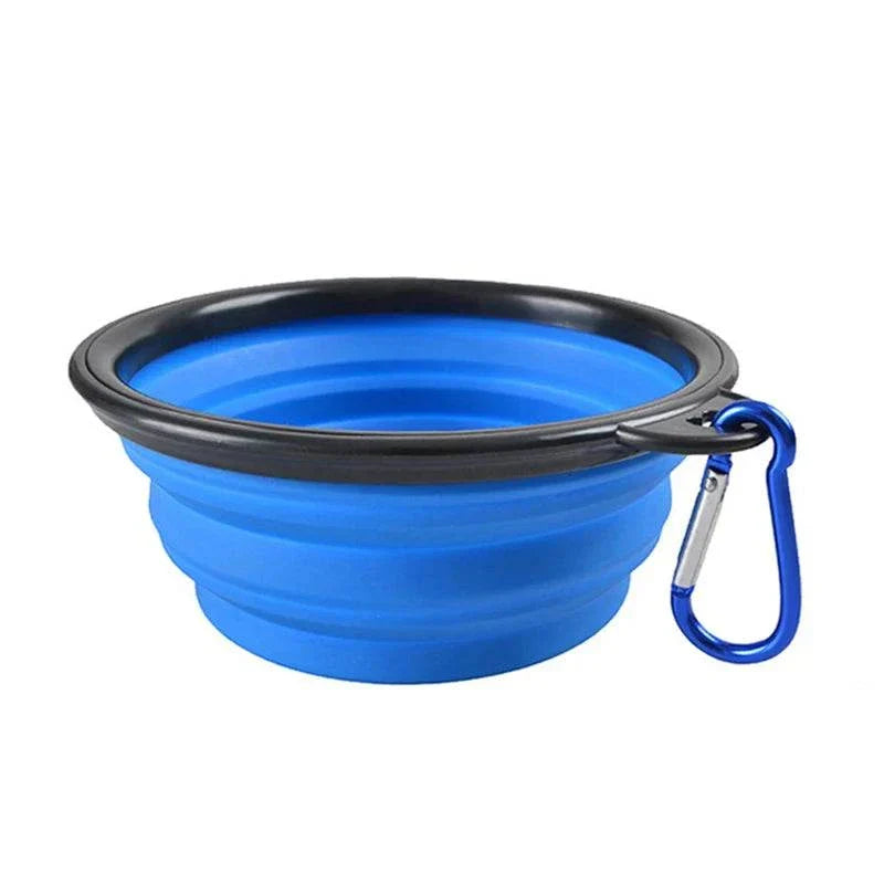 Folding portable silicone dog feeder bowl with carabiner for food and water.