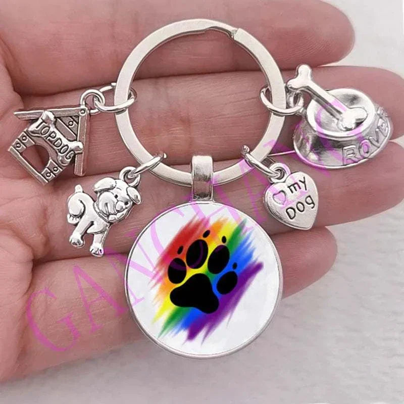 Dog paw keychain with colorful glass pendant and silver charms.