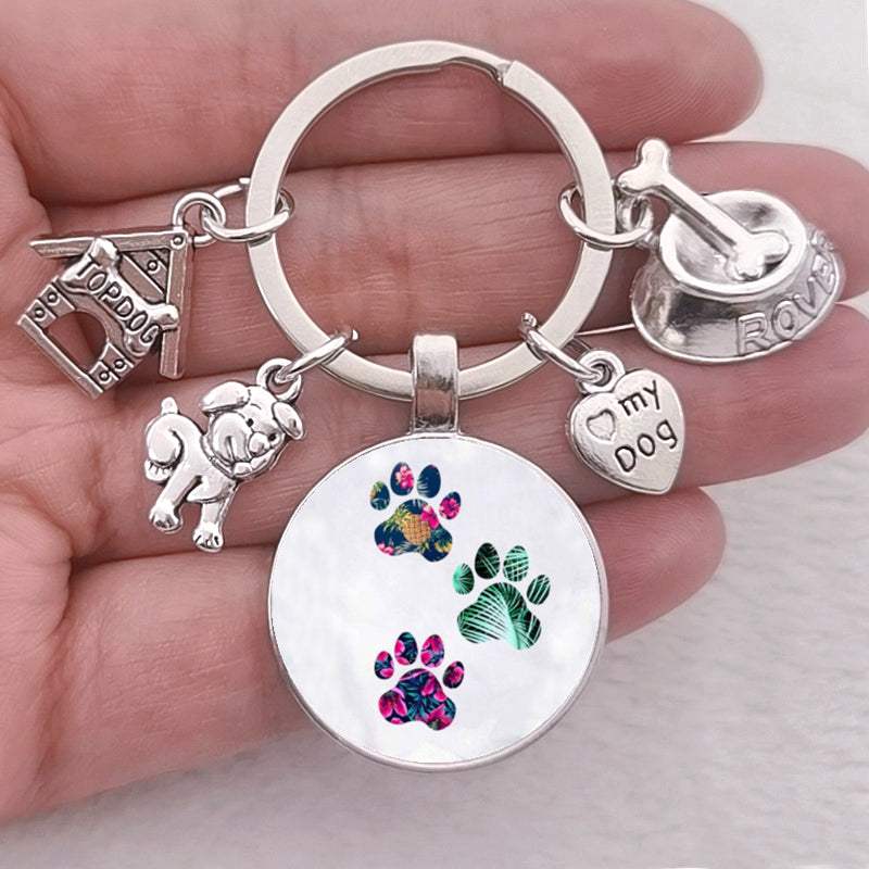 Cute dog paw keychain with colorful glass pendant and antique silver charms.