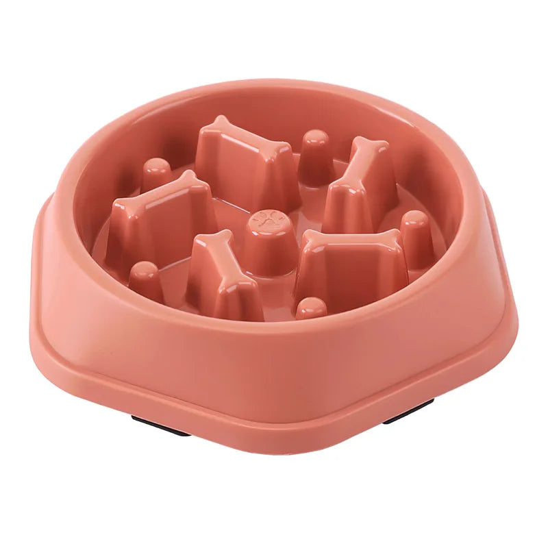 Slow feeder bowl for small and medium dogs in pink plastic with bone-shaped design, suitable for medium-sized dog breeds.