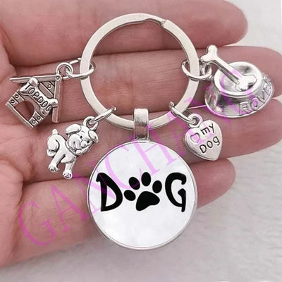 Cute dog keychain with glass pendant and antique silver plated charms.