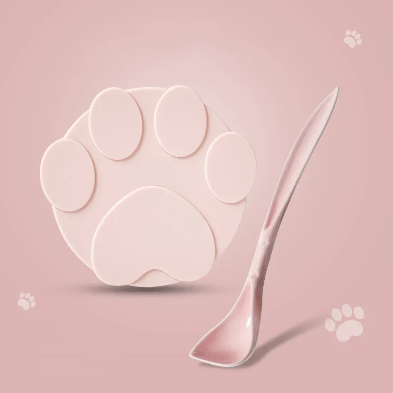 Portable silicone pet food lid and spoon set in pink paw design. Pet Food Lid and Spoon