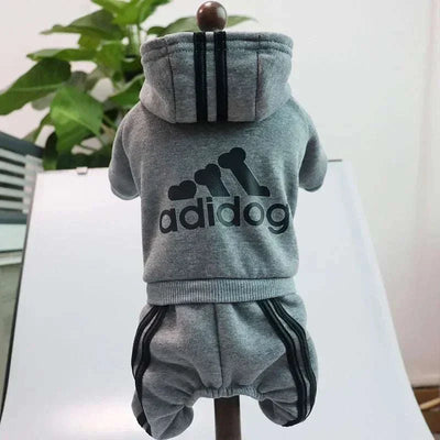 Small dog wearing gray Adidog fleece hoodie jumpsuit, polyester material, autumn/winter fashion style, available in 7 colors.