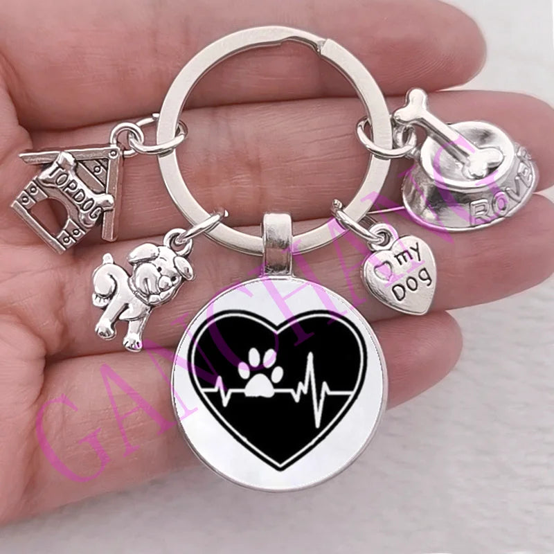 Cute dog paw keychain with glass pendant, trendy antique silver-plated design.