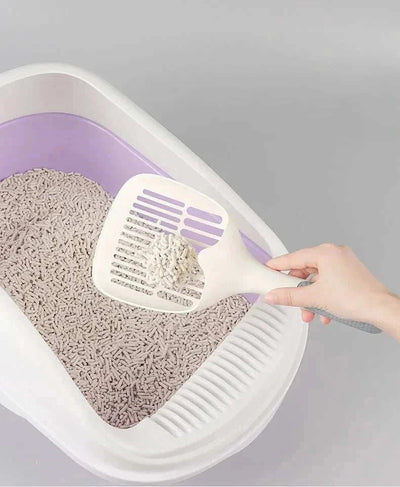 Large cat litter scoop used for easy waste removal in a litter box. large litter scoop