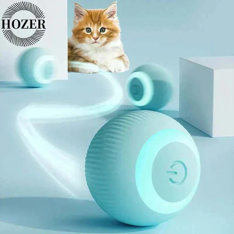 Automatic rolling smart interactive cat ball in action, captivating a curious cat indoors.