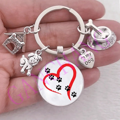 Cute dog paw keychain with glass pendant and charms in antique silver plated zinc alloy.