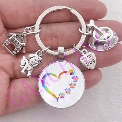 Cute Dog Paw Keychain with Glass Pendant, zinc alloy, rainbow heart design, unisex accessory.