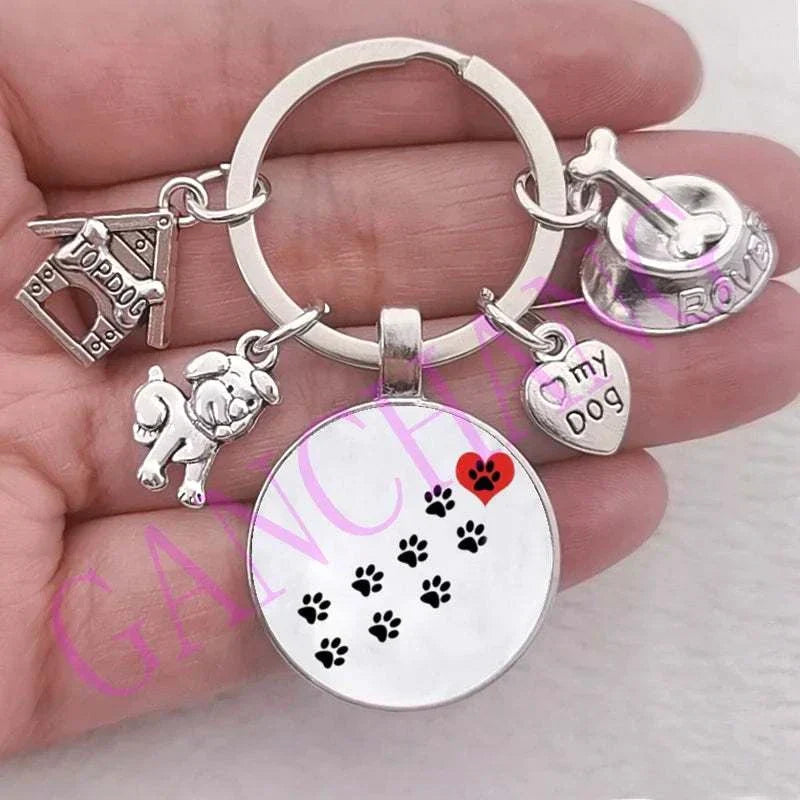 Cute dog keychain with glass pendant and antique silver plated charms.