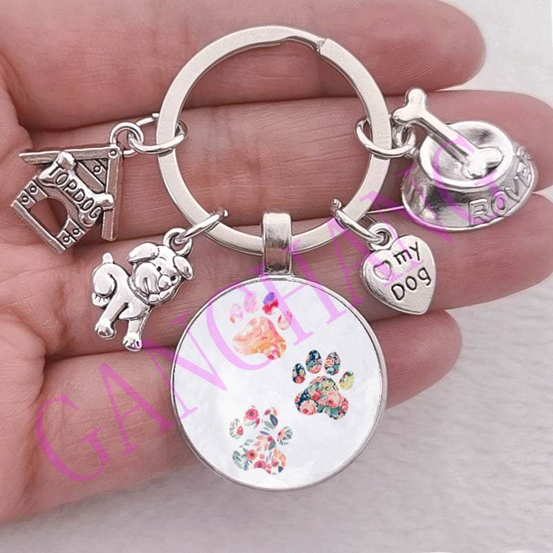 Cute dog paw keychain with glass pendant, zinc alloy material, antique silver plated, trendy style.