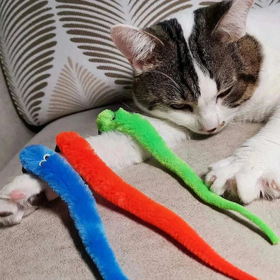 Plush cat toy replacement heads in blue, orange, and green, displayed with a cat.