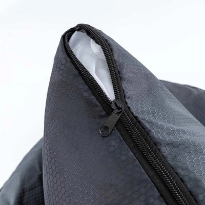 Close-up of a gray polyester car seat cover for small dogs, featuring a zipper and breathable design.