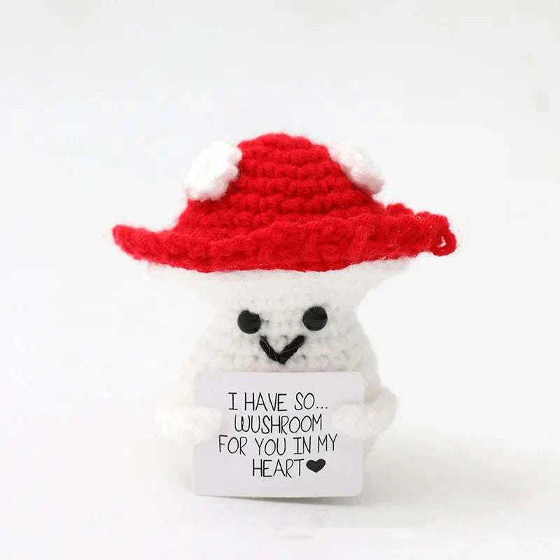 Handwoven crochet duck ornament with red hat, promoting positive energy, handmade textile art.