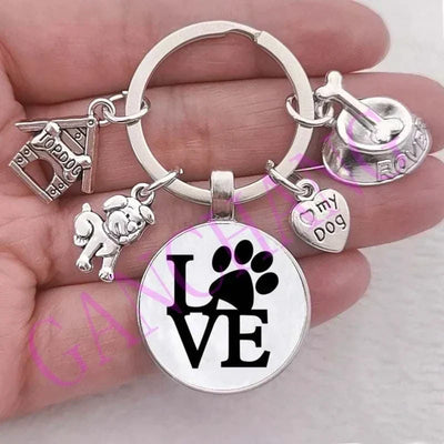 Cute dog paw keychain with glass pendant, antique silver plated design.